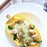 Gluten free pesto chicken spaghetti squash bowls are easy and delicious to put together! Fresh baked spaghetti squash gets a makeover once topped with pesto, juicy chicken pieces, and melty cheese!