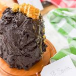This gluten free dark chocolate honey triple layer cake is the ultimate in chocolate decadence. Three moist chocolate mini cakes are stacked with rich dark chocolate frosting layers before being topped with lush honeycomb pieces and gooey honey drizzle. Perfect holiday gift idea for the chocolate and honey lover in your life!