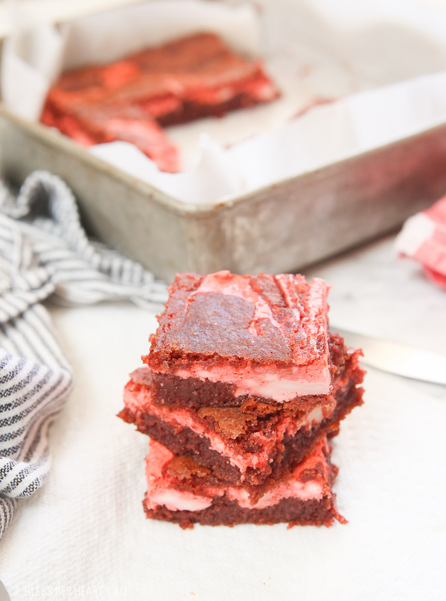 Moist and delicious gluten free red velvet cheesecake bars are quick and easy to make, are extremely creamy and decadent, and are perfect when you are in the mood for a little indulgence! There is still plenty of time to whip these up before Valentine's Day y'all!