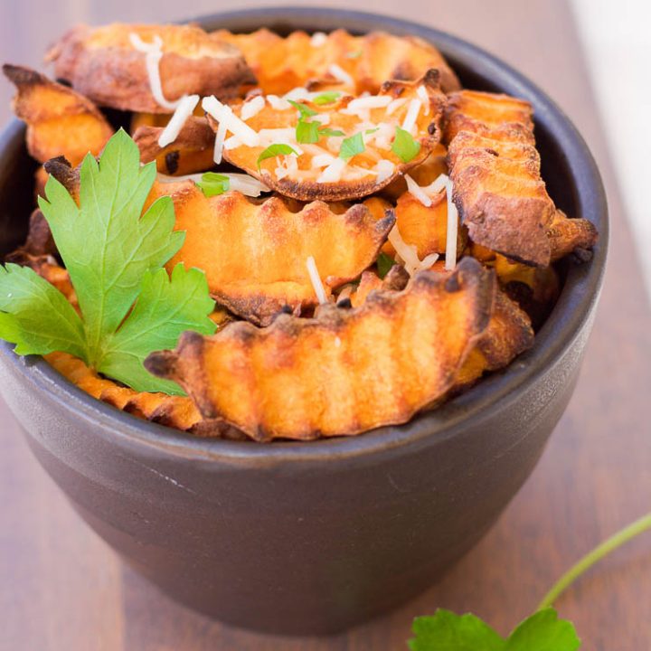 These baked parmesan sweet potato fries are amazingly easy to make with simple ingredients. The hints of savory garlic and parmesan blend perfectly with the sweetness of the sweet potato pieces!
