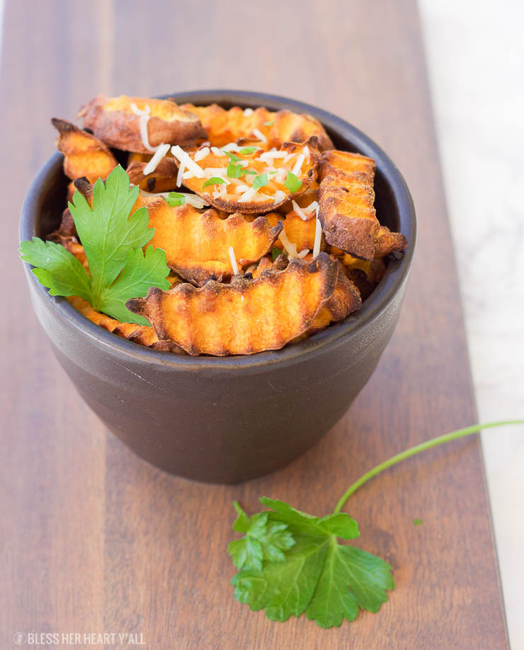 These baked parmesan sweet potato fries are amazingly easy to make with simple ingredients. The hints of savory garlic and parmesan blend perfectly with the sweetness of the sweet potato pieces!