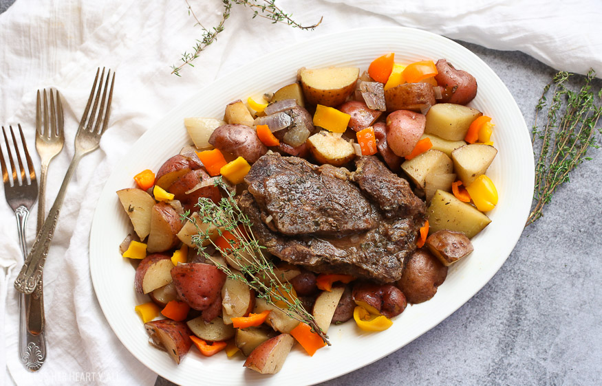 A summer slow cooker pot roast slowly simmers a generous beef roast with hearty potatoes and summer's fresh vegetables in a broth swimming with garlic, onion, thyme, and oregano. Keep cool and let your crock pot do all the hard work!