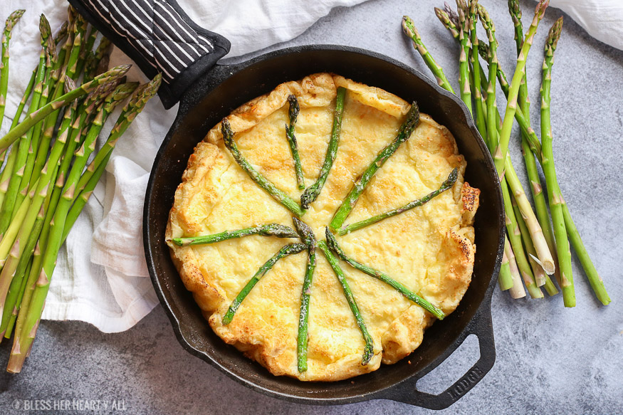 gluten free swiss asparagus dutch baby is the most moist, smooth, doughy and cheesy dutch baby and so easy to make! Just bake for 12-15 minutes!