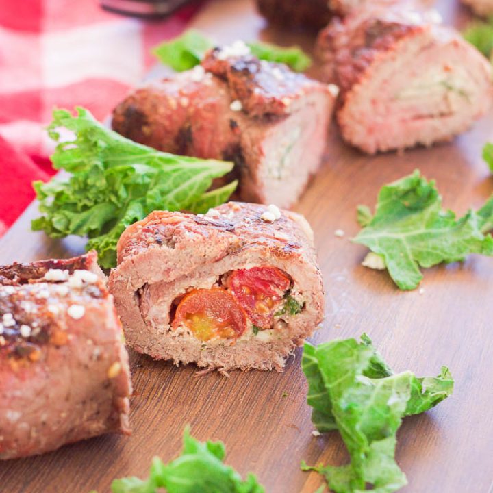 These grilled spicy steak pinwheels use a mixture of cotija cheese, grape tomatoes, pepper flakes, and arugula leaves all wrapped up in some yummy thinly-sliced steak. The drooling starts now! www.BlessHerHeartYall.com