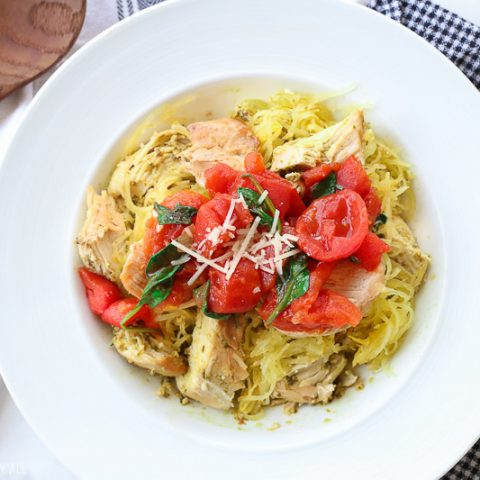 This spinach tomato spaghetti squash recipe combines fresh fluffy spaghetti squash and tops it with an easy and quick spinach and tomato sauce that's so garlicky and savory, the perfect combination of a healthy tasty meal!