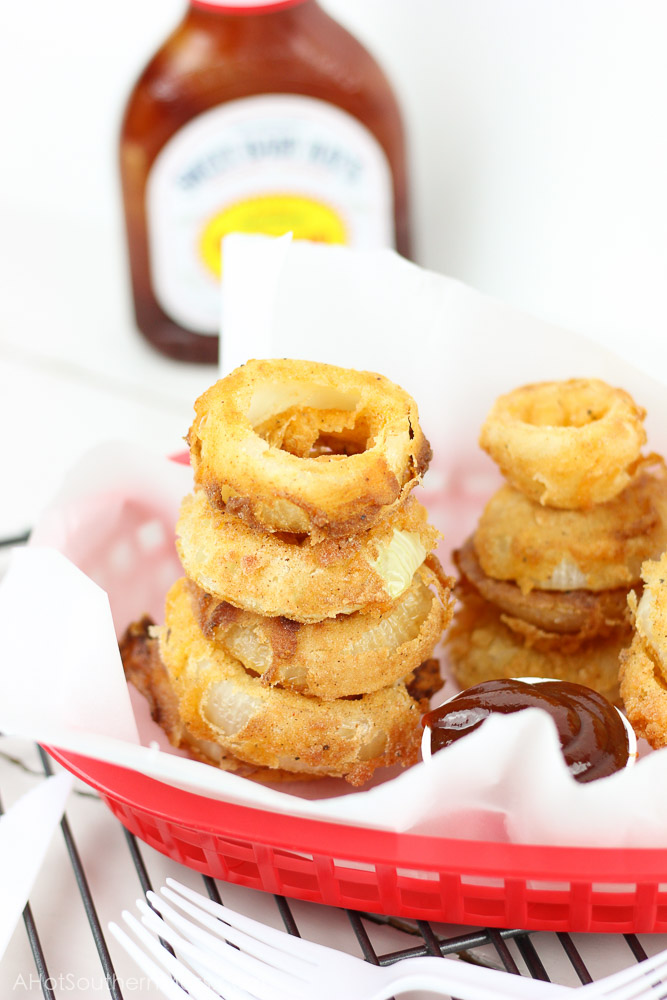 Crunchy, crispy, and barbecue-y! These BBQ and Buttermilk Onion Rings are easily made at home with just a few simple ingredients and in only minutes! www.ahotsouthernmess.com