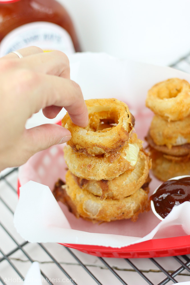 Crunchy, crispy, and barbecue-y! These BBQ and Buttermilk Onion Rings are easily made at home with just a few simple ingredients and in only minutes! www.ahotsouthernmess.com