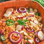 chipotle lime radish salad in a wooden bowl