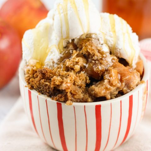 This gluten-free peach apple crumble is a favorite fall treat. Crisp apples are mixed with sweet end-of-season peaches as a base. Cinnamon, brown sugar, gluten-free oats, and lemon juice are combined with a bit of sweet cream butter, to finish off the candy-like crumble topping. Serve right out of the oven with soft vanilla bean ice cream and a fresh honey drizzle. www.ahotsouthernmess.com
