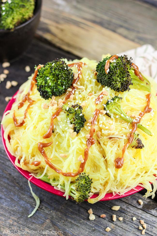 Spicy Peanut Spaghetti Squash A creamy sweet and spicy peanut sauce is drizzled over crispy and tender roasted broccoli and spaghetti squash. Add in your favorite protein, like grilled chicken breasts if you’d like. It’s the perfect easy 30-minute meal combination of Asian meets healthy! www.ahotsouthernmess.com