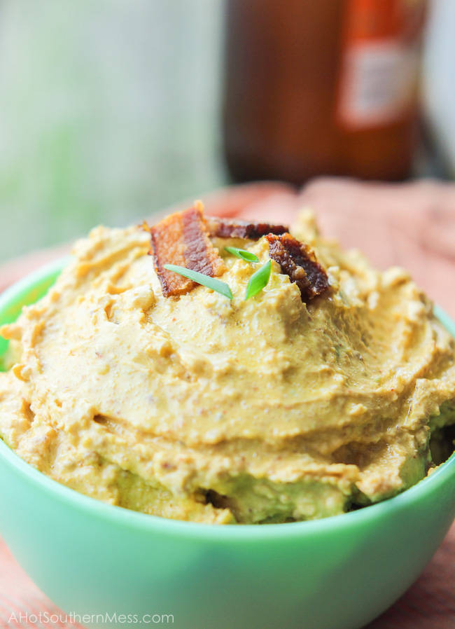 This gluten-free spicy pumpkin bacon dip is the perfect party snack to bring to your next fall party, tailgate, or couch snack. This spicy dip combines the healthy creaminess of greek yogurt cream cheese and pumpkin, with the heartiness of the cheese and bacon, and the spice of garlic, green onion, and cayenne pepper. Put this lightened up dip out with your favorite dippers and it will be gone in seconds. www.ahotsouthernmess.com