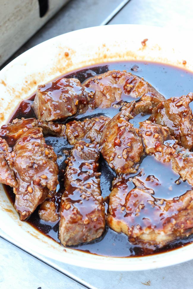 Spicy sticky asian ribs are drizzled in sweet and spicy glaze, kissed to a slight crunch on the grill, and melt-in-your-mouth, incredibly tender on the inside. These pork ribs are finger-lickin' and slap yo mama silly kind of 'good'. www.ahotsouthernmess.com