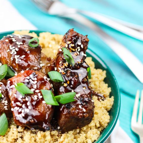 Spicy sticky asian ribs are drizzled in sweet and spicy glaze, kissed to a slight crunch on the grill, and melt-in-your-mouth, incredibly tender on the inside. These pork ribs are finger-lickin' and slap yo mama silly kind of 'good'. www.ahotsouthernmess.com