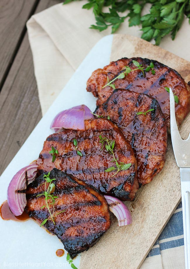 These gluten-free southern cayenne glazed pork chops are an easy 5-ingredient recipe that combines the sweetness of brown sugar with the spiciness of cayenne pepper. A few minutes marinating and then quickly kissed on the grill, these southern glazed pork chops create a tender, juicy, flavorful meal in just minutes! www.blessherheartyall.com