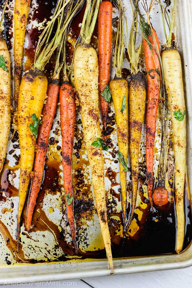 With 5 minutes of prep work and a couple of simple ingredients, these spicy honey garlic roasted carrots are an easy gluten-free fall side dish that is both full of flavor and healthy. With the combination of chili powder, garlic, and honey, with an easy balsamic glaze drizzle, you have both a sweet and spicy, tender yet crunchy vegetable for your table spread. www.ahotsouthernmess.com