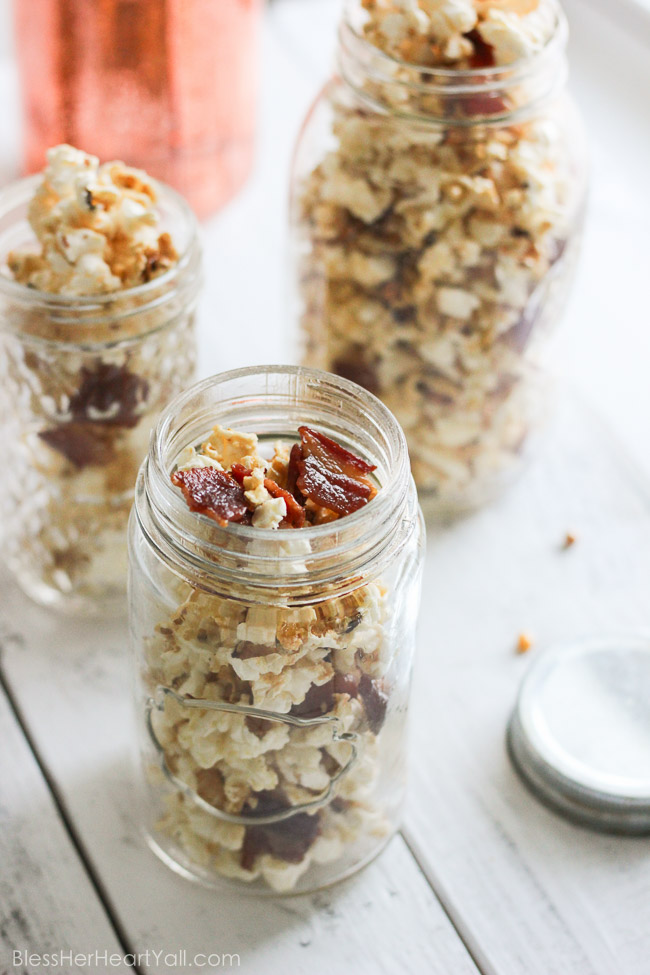 This maple, bacon, bourbon popcorn hits all the right spots, with it's freshly popped popcorn, sprinkled with thick-cut applewood bacon, and then drizzled with butter, salt, maple syrup, and of course bourbon! It's a quick, easy, and inexpensive DIY gift for friends, co-workers, and host/hostess's this holiday season! www.blessherheartyall.com DIY Hostess Gift: Maple, Bacon, Bourbon Popcorn