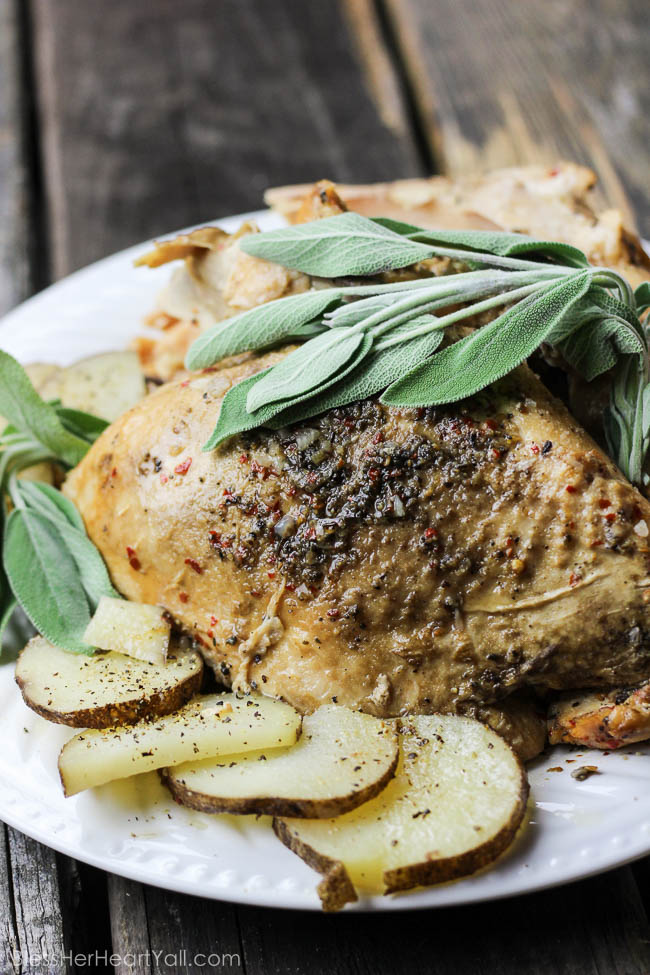 Spicy Sage Slow Cooker Turkey: A combination of sage and garlic combine deliciously with a little heat {only if you want it!} in a slow cooker for the most juicy and moist turkey you will ever eat! 5 minutes of prep work gives you a Thanksgiving Day main meal that is falling-off-the-bone! www.blessherheartyall.com