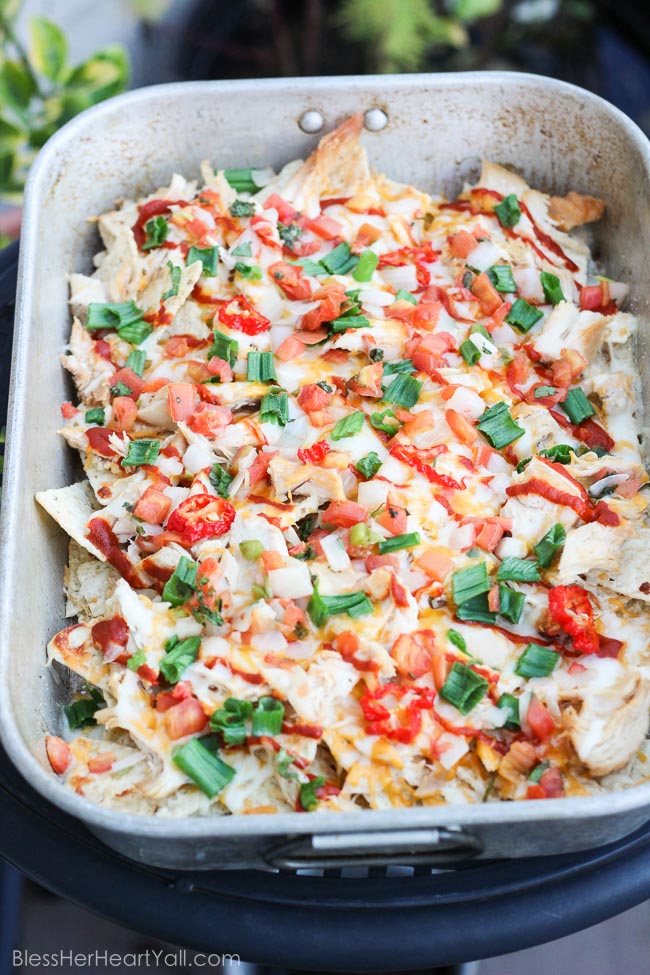 These Thanksgiving leftovers are so quick and easy to put together and serve while watching all those football games and during all of the family activities this Thanksgiving weekend. These turkey nachos turn your leftover turkey stash into a cheesy, crunchy, spicy {you know me...I just gotta add spice!}, gluten-free party food that will be scooped up in seconds! www.blessherheartyall.com