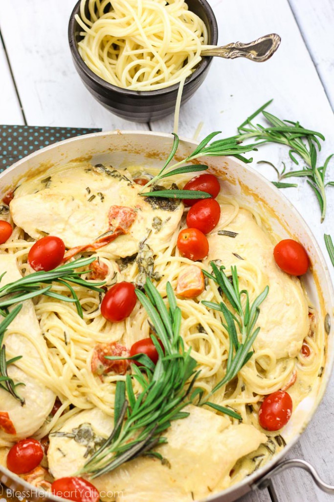 This one-pot rosemary goat cheese chicken pasta skillet is a cheesy, creamy, 30-minute meal with bold flavors! This pasta skillet incorporates garlic, cream, goat cheese, and rosemary as a base for the creamy sauce. Then gluten-free noodles, chicken breasts, and fresh tomatoes and spinach leaves are mixed together and smothered in this hearty and flavorful sauce! www.blessherheartyall.com