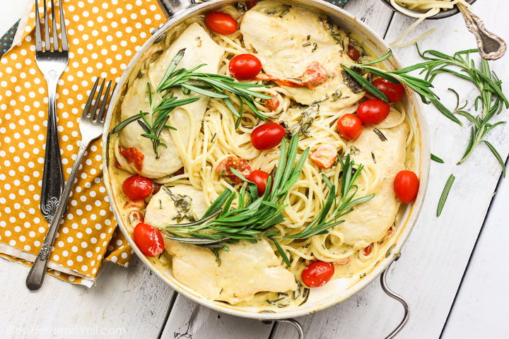 This one-pot rosemary goat cheese chicken pasta skillet is a cheesy, creamy, 30-minute meal with bold flavors! This pasta skillet incorporates garlic, cream, goat cheese, and rosemary as a base for the creamy sauce. Then gluten-free noodles, chicken breasts, and fresh tomatoes and spinach leaves are mixed together and smothered in this hearty and flavorful sauce! www.blessherheartyall.com