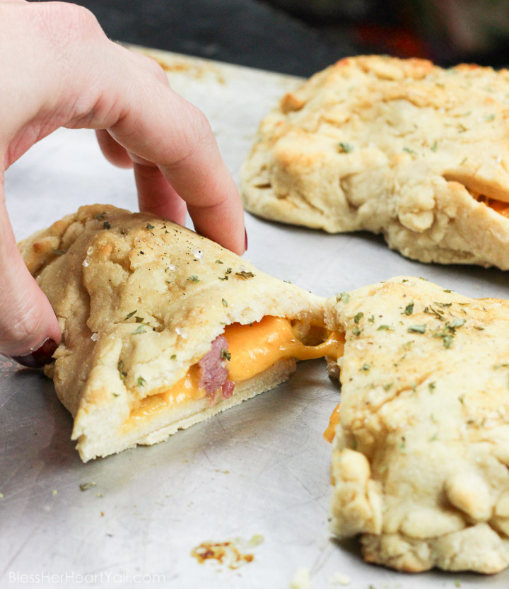 These gluten-free ham and cheese hot pockets are the real deal! Perfectly crispy pockets of smooth soft dough are stuffed with leftover Christmas ham and melty cheese, closed up, and brushed with an olive oil, honey, brown sugar, and garlic sauce. It's the perfect tasty meal on-the-go and a great way to finish off those Christmas ham leftovers! www.blessherheartyall.com