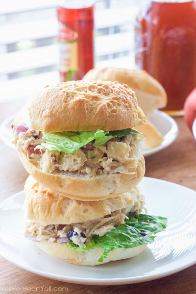 OMG yum! This rosemary greek yogurt chicken salad is a light and fresh (and gluten-free!) approach to chicken salad! The list of healthy ingredients come together to make one sweet and savory masterpiece of a salad or gluten free sandwich!