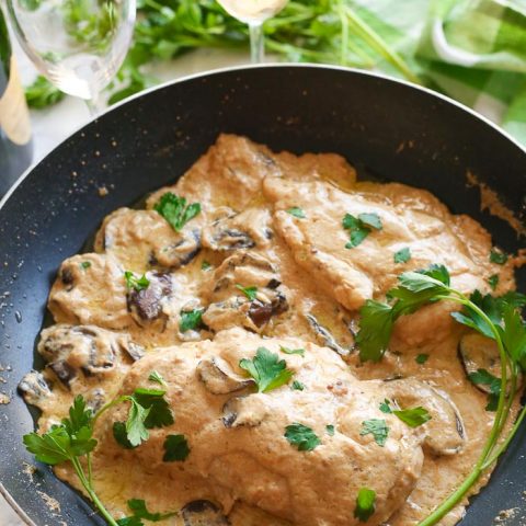 champagne chicken with mushrooms cooked in skillet