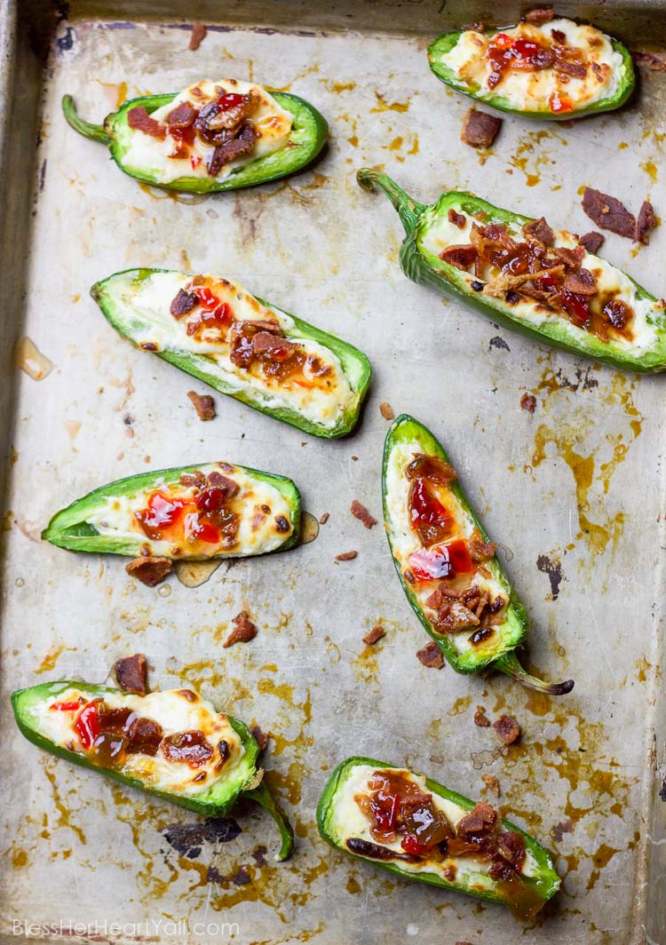 These bacon goat cheese jalapeno poppers are a fast and delicious little appetizer full of creamy goat cheese, crisp bacon crumbles, and sweet pepper jelly overtop quickly charred jalapenos for the perfect sweet and spicy party treat!