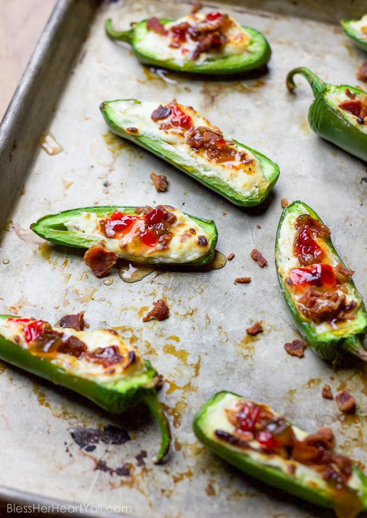 These bacon goat cheese jalapeno poppers are a fast and delicious little appetizer full of creamy goat cheese, crisp bacon crumbles, and sweet pepper jelly overtop quickly charred jalapenos for the perfect sweet and spicy party treat!
