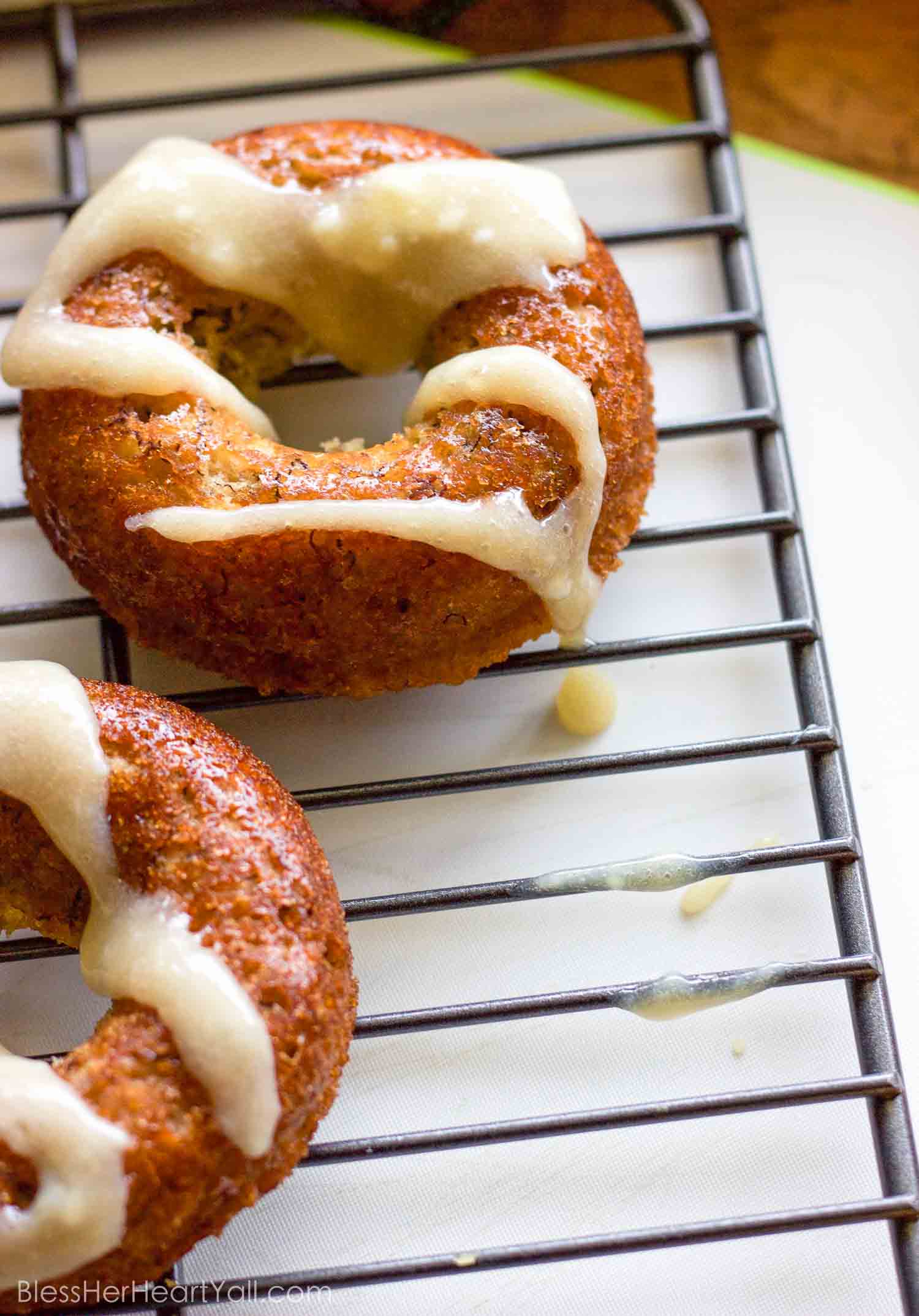 These gluten-free banana bread donuts are a great reason to wake up in the morning! Soft and moist banana bread is baked into fluffy donuts and then drizzled with an easy and quick honey cream cheese drizzle.