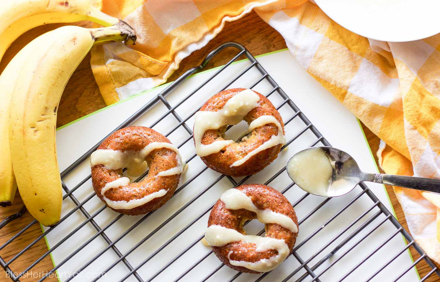 These gluten-free banana bread donuts are a great reason to wake up in the morning! Soft and moist banana bread is baked into fluffy donuts and then drizzled with an easy and quick honey cream cheese drizzle.