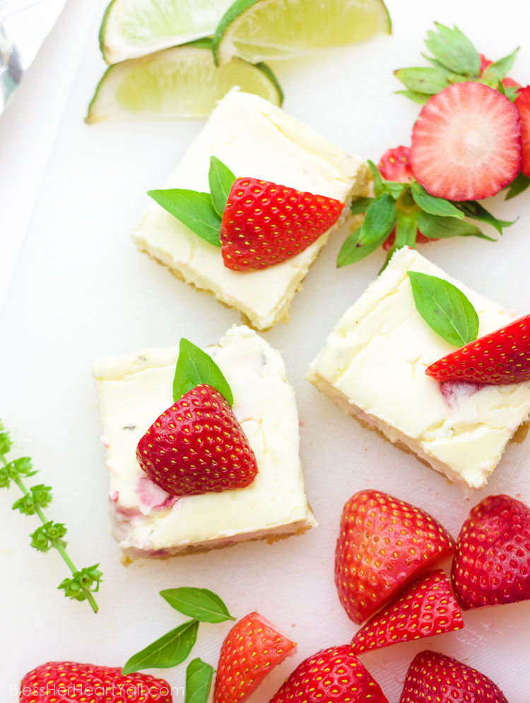gluten-free strawberry basil margarita cheesecake squares with fresh strawberries on top