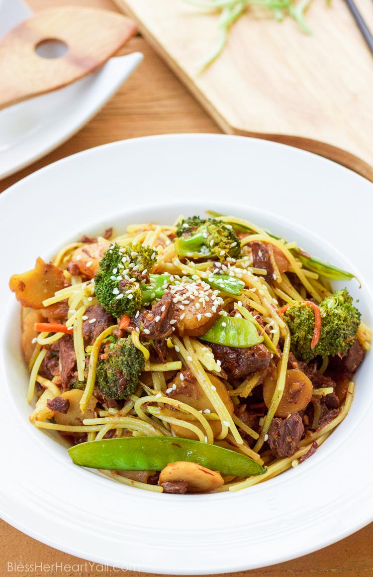 This slow cooker beef lo mein tosses budget-friendly pieces of beef into an easy asian-inspired sauce and turns in into a delicious spicy garlicky noodle-y gluten-free dish that's perfect for those busy weeknights!