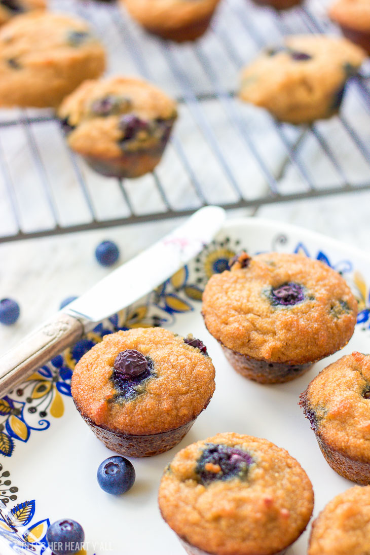 These gluten-free blueberry mini muffins are also grain-free and dairy-free! Grab a few of these moist fluffy muffins for your busy mornings on-the-go!