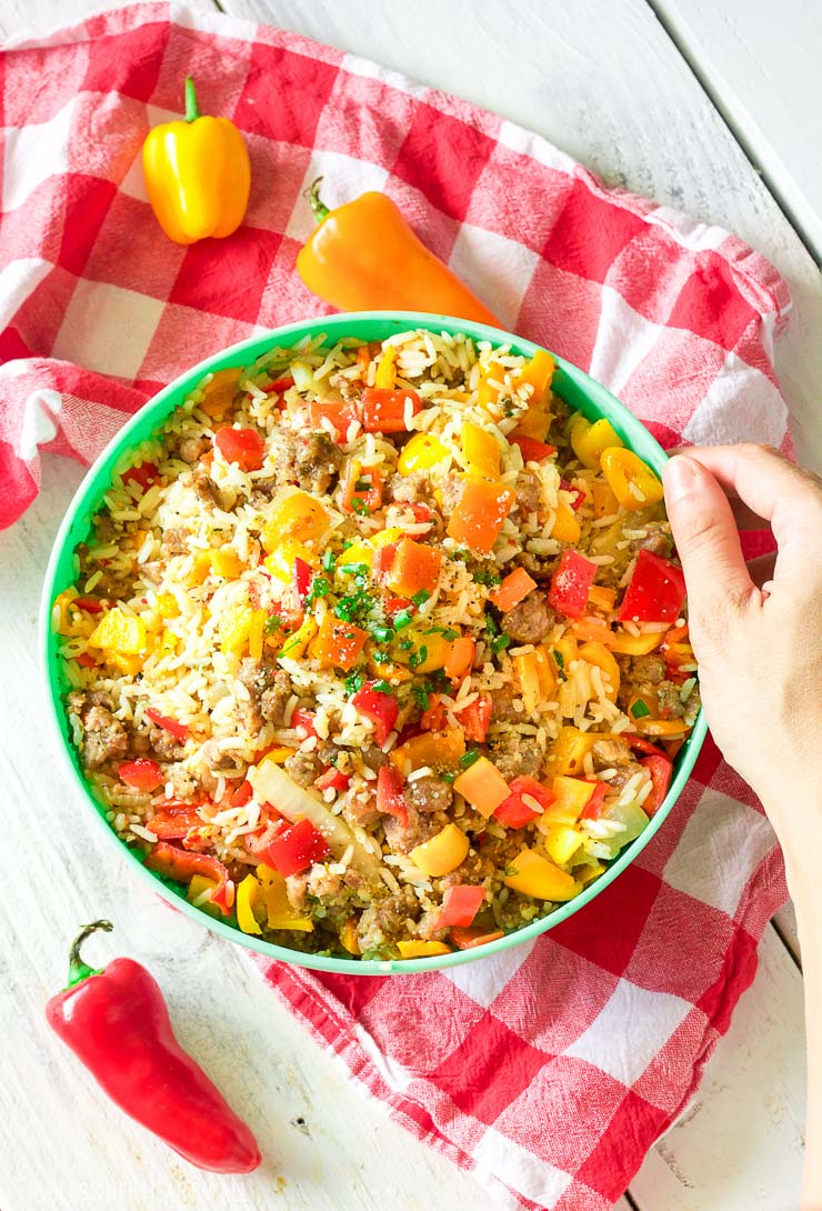 This gluten-free chopped stuffed pepper salad combines spicy sausage with fresh diced bell peppers and sweet onion, fluffy rice, and is seasoned with a combination of sizzling creole spices for one salad that is burst with flavor spoonful after spoonful!