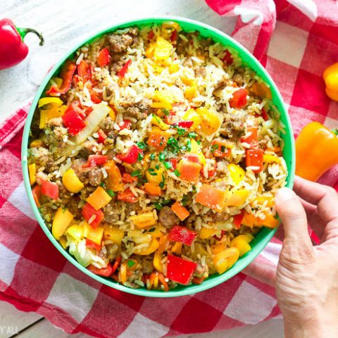 This gluten-free chopped stuffed pepper salad combines spicy sausage with fresh diced bell peppers and sweet onion, fluffy rice, and is seasoned with a combination of sizzling creole spices for one salad that is burst with flavor spoonful after spoonful!