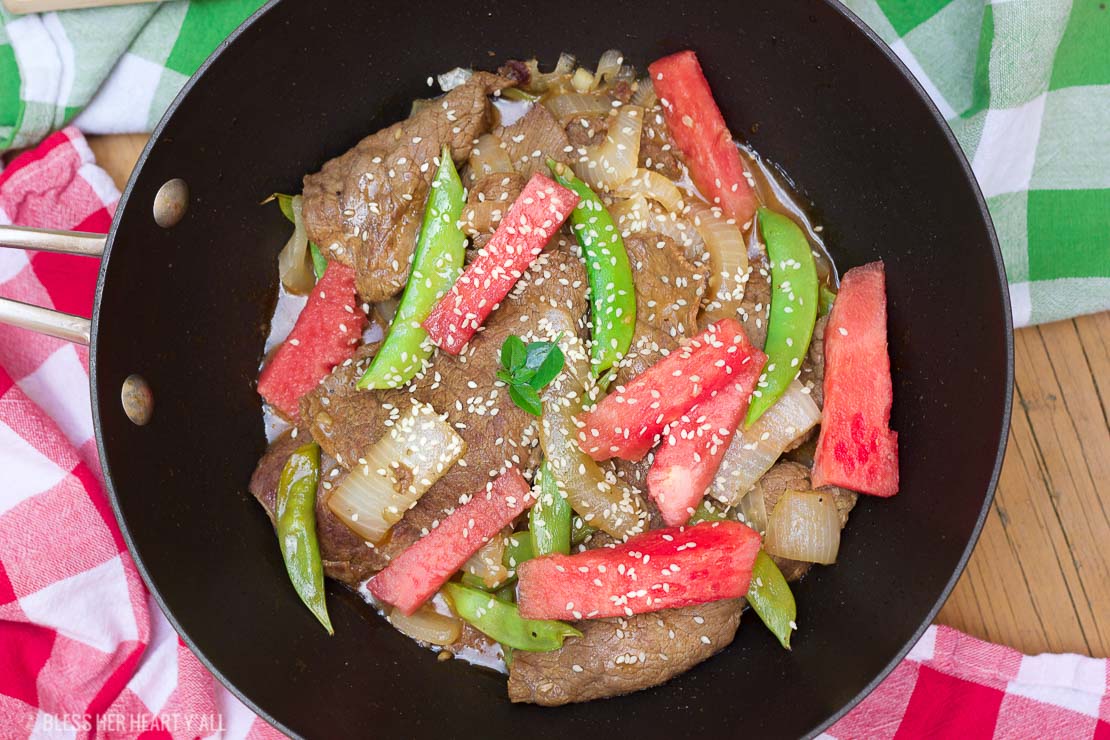 This simple watermelon stir-fry recipe combines the sweet refreshing flavors of juicy ripe watermelon with the savoury flavors of the asian-inspired stir-fry! The perfect-for-summer sauce has just a touch of sweet and light with it's combination of fresh lime juice and garlic. This summer dish definitely won't weigh you down in the sizzling heat!