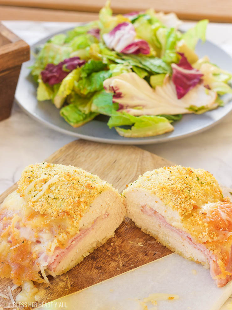 This gluten free chicken cordon bleu recipe is both quick and easy. Crunchy outer coating and juicy chicken in the middle, all topped with warm ham and ooey gooey melted swiss cheese! www.blessherheartyall.com