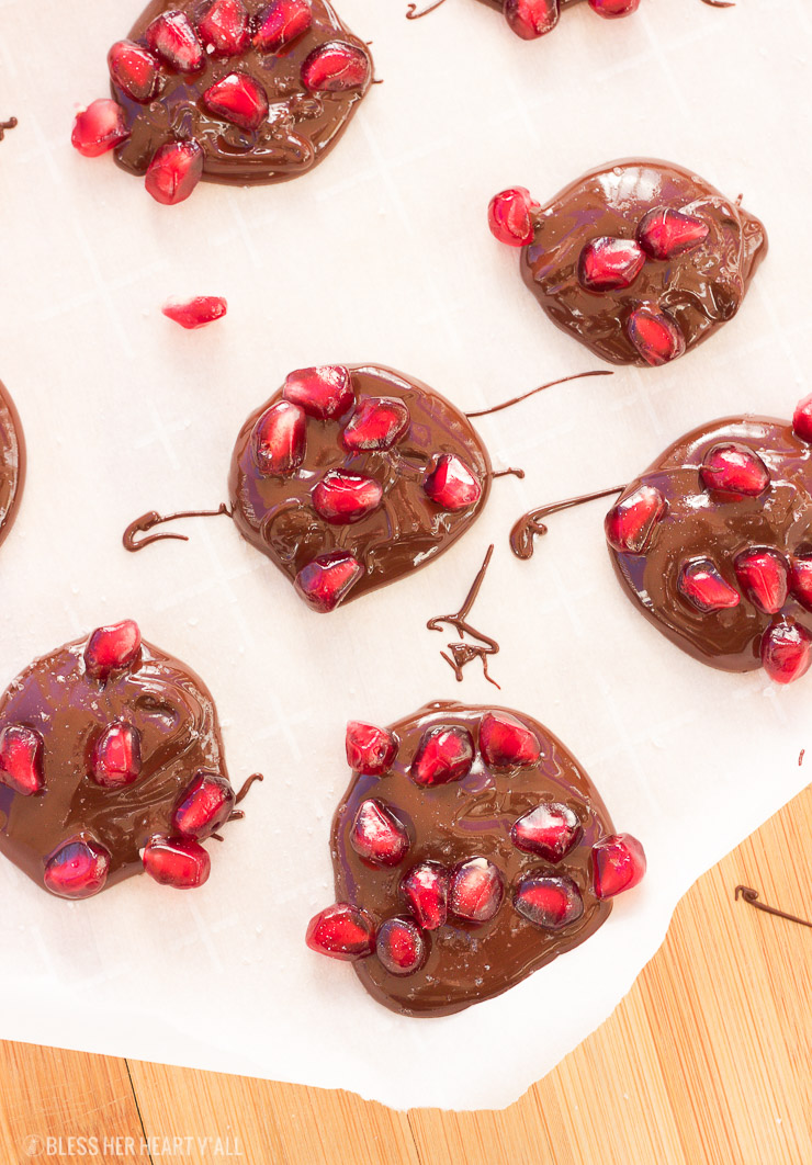 Dark chocolate pomegranate bites are the perfect quick and easy appetizer or sweet snack for the holiday season! Melted dark chocolate is sprinkled with pomegranate arils and sea salt before being allowed to harden and disappear.