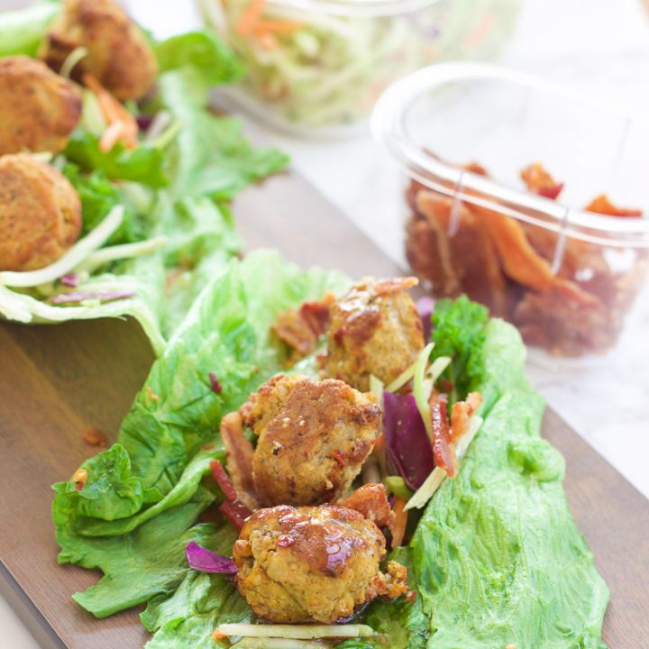This pumpkin sage meatball lettuce wrap + hot bacon vinaigrette recipe is juicy and savory, with fresh crisp vegetables and moist round meatballs drizzled in a warm bacon dressing with a touch of heat!