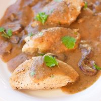 This one-pot garlic mushroom chicken skillet cooks juicy chicken breasts and uses the drippings to make a quick creamy garlic mushroom gravy. The thick savory sauce brings out a cozy warm flavor to this comfort food, perfect for when you only have 20 minutes to spare!