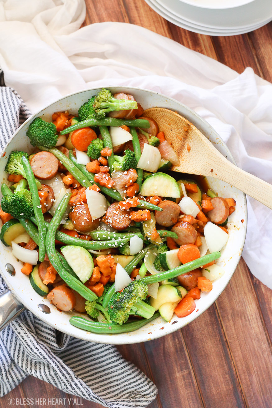 Sweet potato stir fry with chicken sausage slices are combined with fresh vegetables and a simple sweet and savory paleo stir fry sauce for one epically healthy meal your family will ask for time and time again.