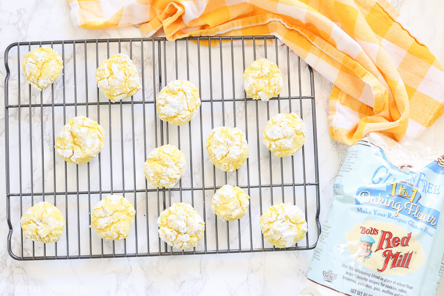 Gluten free lemon crinkle cookies combine light fresh lemon flavors into soft and doughy cookies that are sprinkled in delicious powdered sugar before being baked for a quick 10 minutes!