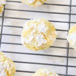 Gluten free lemon crinkle cookies combine light fresh lemon flavors into soft and doughy cookies that are sprinkled in delicious powdered sugar before being baked for a quick 10 minutes!