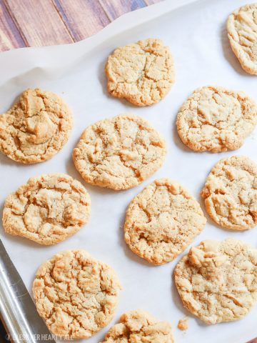 These 4-ingredient gluten free peanut butter cookies take creamy peanut butter, sugar, baking soda, and an egg and in 10 minutes turn it into soft and doughy-centered gluten free peanut butter cookies with perfectly crispy golden brown outer edges. Perfect for dunking in a cold glass of milk!