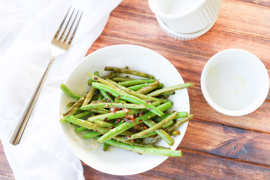 This easy 10-minute teriyaki green beans recipe sautées fresh or frozen green beans with chopped onion and garlic in a quick homemade teriyaki sauce that will leave you licking your plate clean!