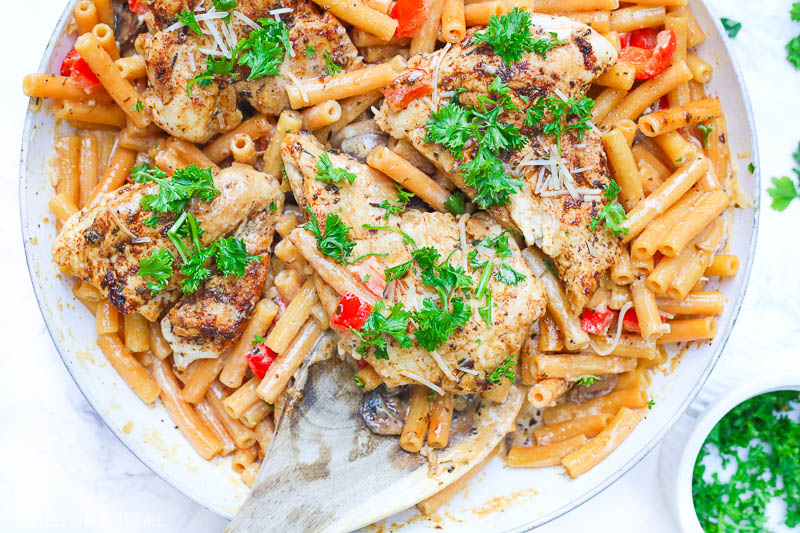 Cajun chicken pasta melts juicy cajun-seasoned chicken breasts with al dente gluten-free noodles in an easy creamy pasta sauce and sprinkled with extra gooey cheeses and herbs all in under 30 minutes! image 8
