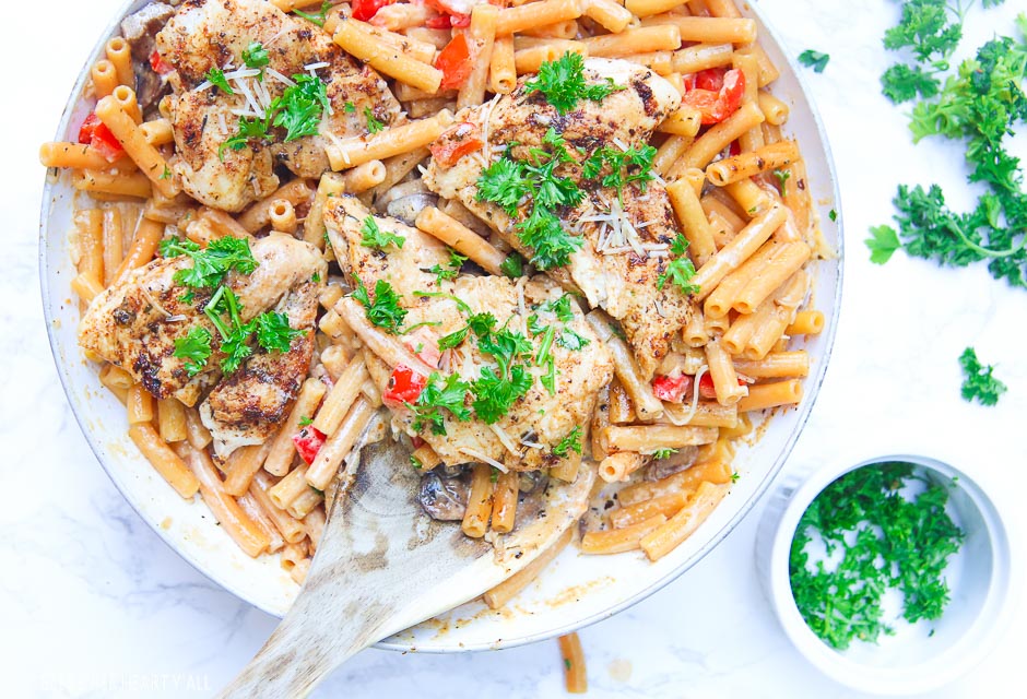 Cajun chicken pasta melts juicy cajun-seasoned chicken breasts with al dente gluten-free noodles in an easy creamy pasta sauce and sprinkled with extra gooey cheeses and herbs all in under 30 minutes! image 9