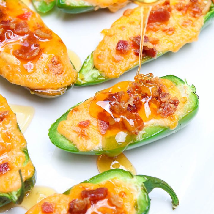 Pimento jalapeno poppers melt fresh jalapenos and pimento cheese together and then top them with crisp bacon crumbles and a drizzle of fresh honey. Each bite combines sweet and spicy with warm melty cheese and crunch. The perfect snack or appetizer in just 5 minutes! 1