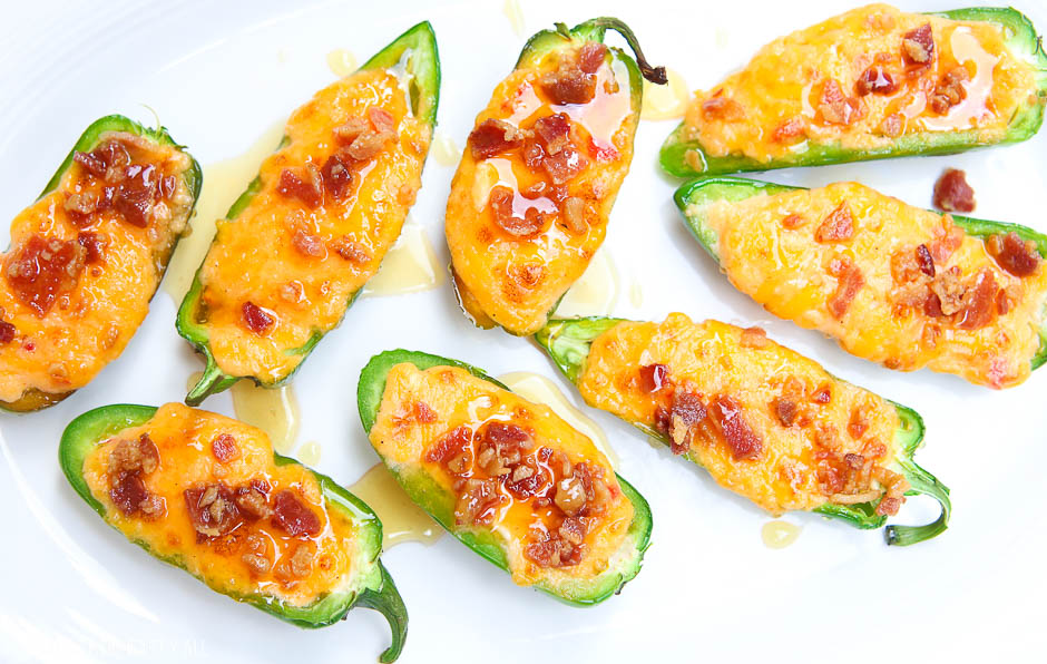 Pimento cheese jalapeno poppers melt fresh jalapenos and pimento cheese together and then top them with crisp bacon crumbles and a drizzle of fresh honey. Each bite combines sweet and spicy with warm melty cheese and crunch. The perfect snack or appetizer in just 5 minutes! 4